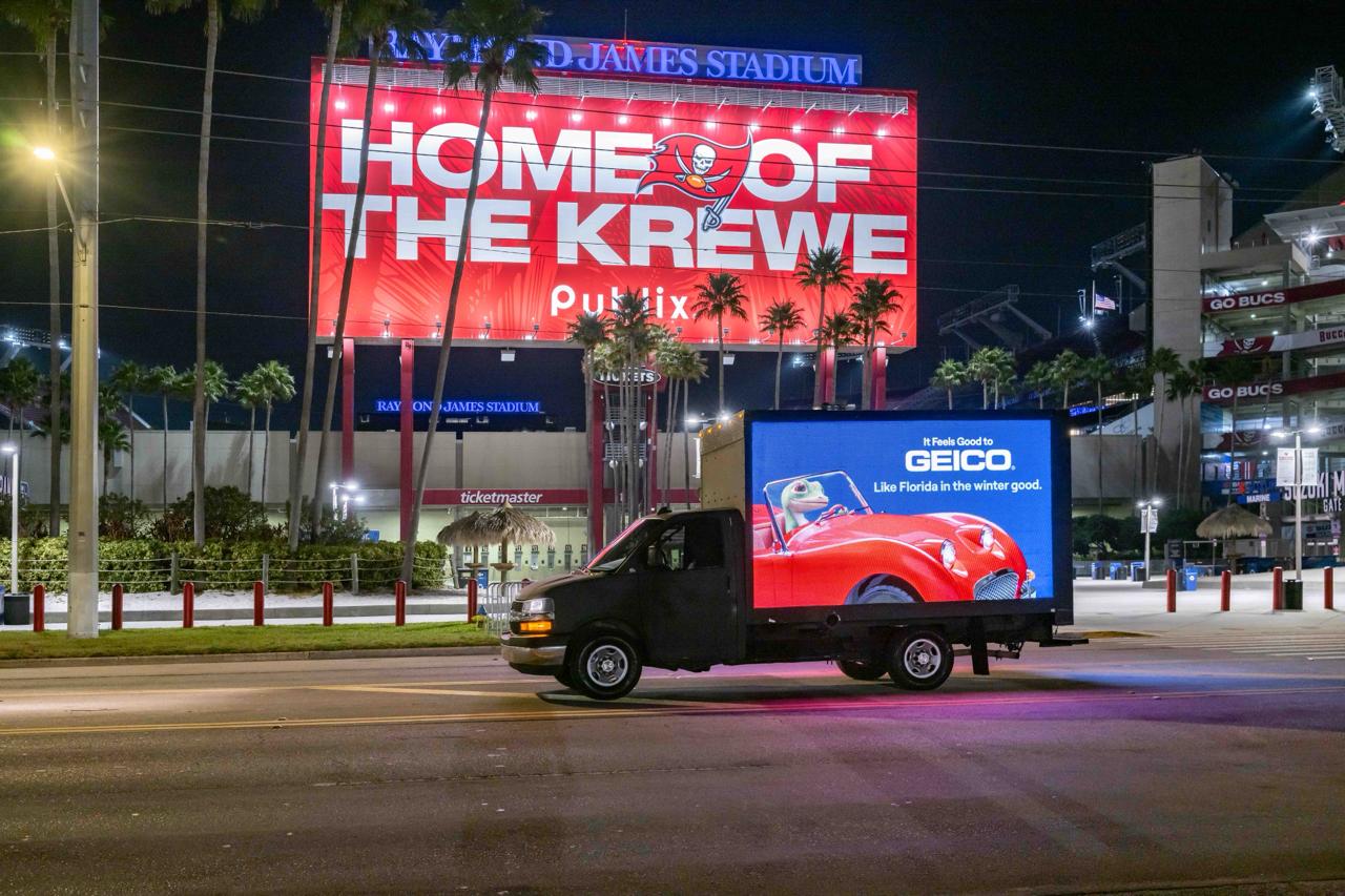GEICO digital mobile billboard truck outside Raymond James Stadium, Tampa