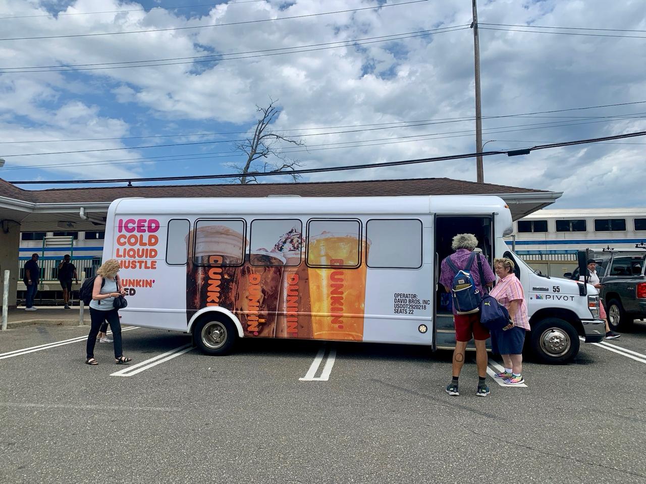 Dunkin' full bus wrap transit advertising