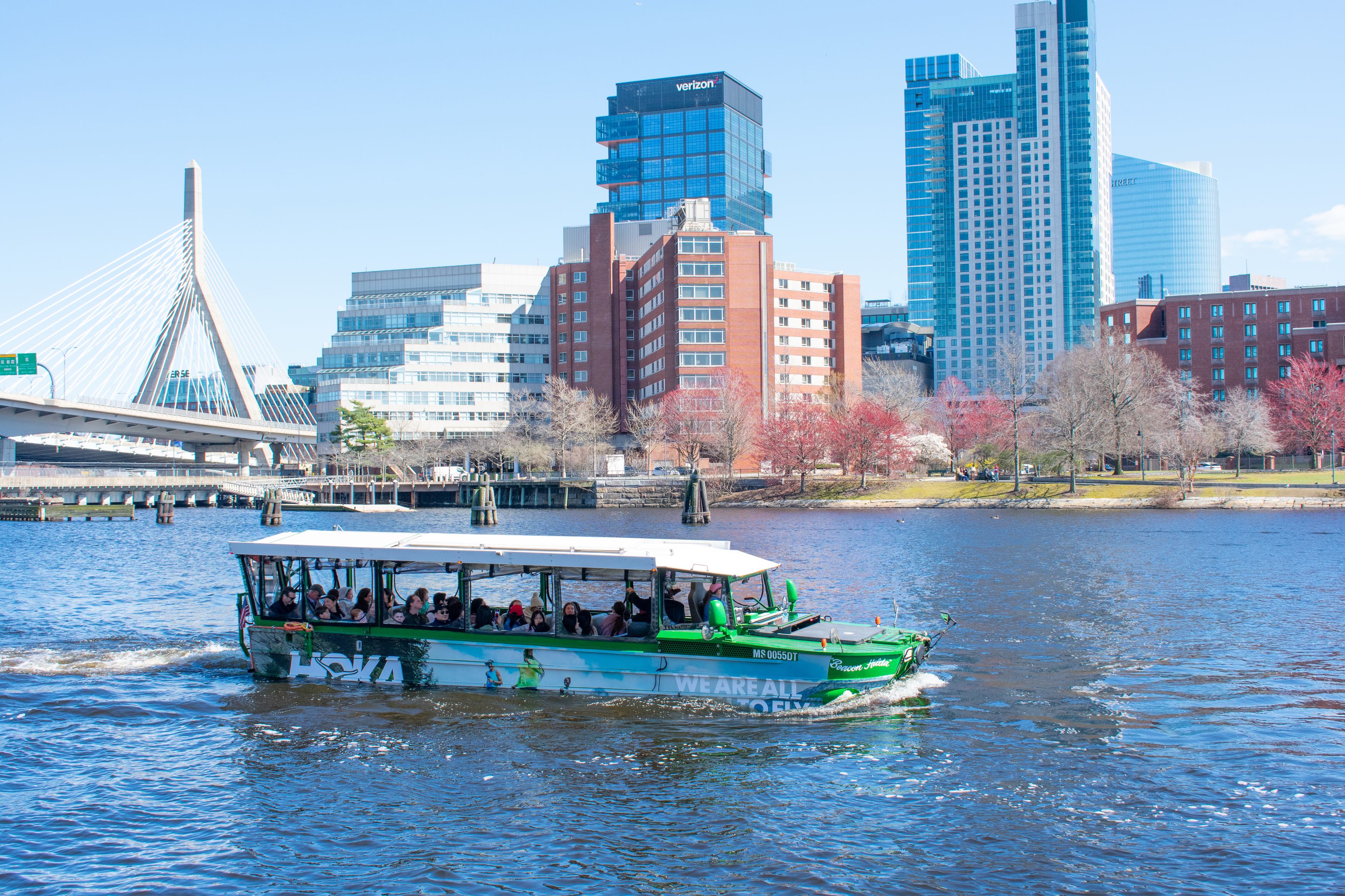 Branded duck boat on the Charles River in Boston with Zakim Bridge